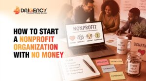 A group of people sitting at a table with a laptop and documents, illustrating the process of starting a nonprofit organization with no money.